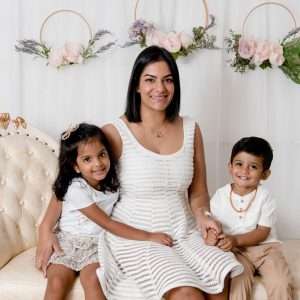 Mum with her two children on a cream sofa during a mummy-and-me studio session, family photography by Twin Lotus Production, Brisbane family photographer